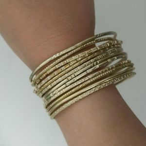 Set of 12 gold bangle bracelets